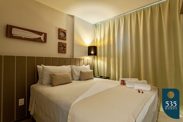 Quarto e Sala com vista mar e comodidades modernas