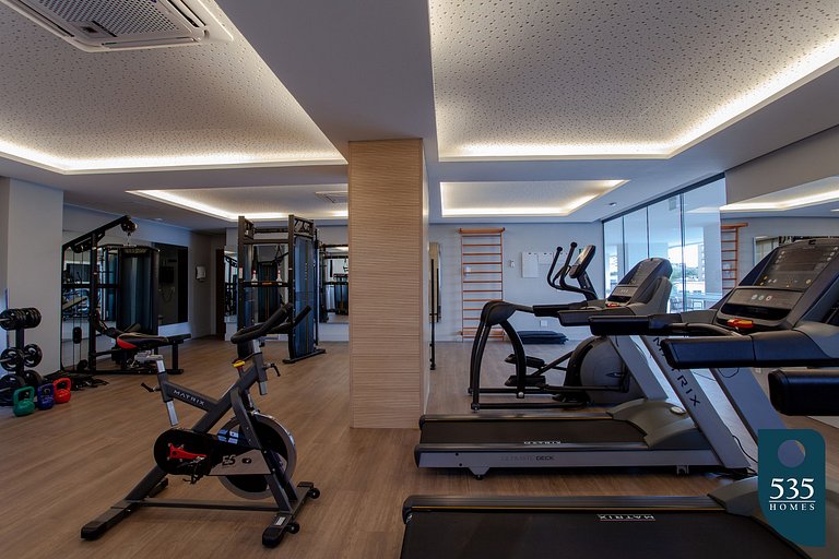 Quarto e Sala com vista mar e comodidades modernas